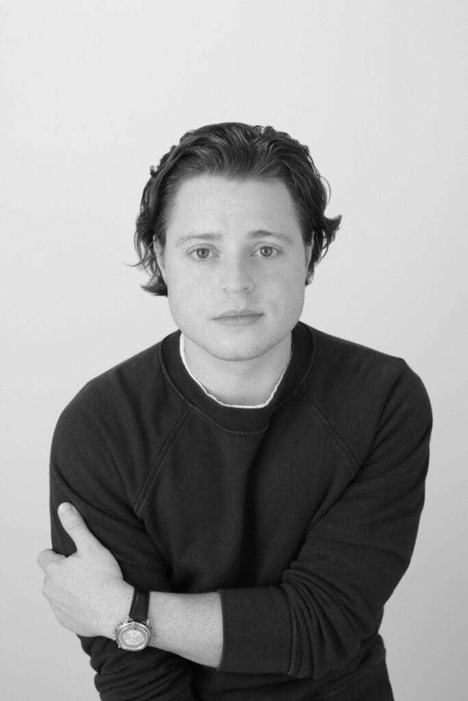 Headshot of Andy Sommer against a light gray background.